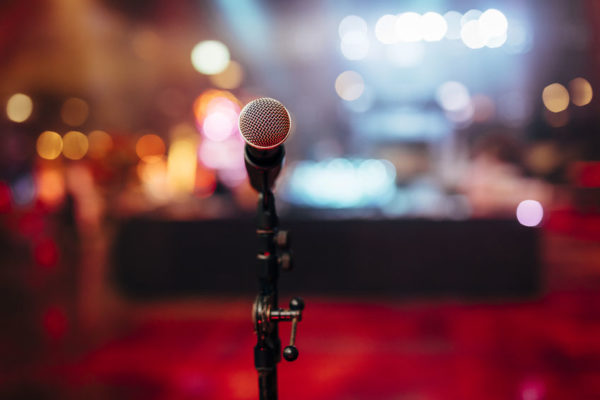 MIC ON A STAGE READY FOR THE SINGER OR SPEAKER
